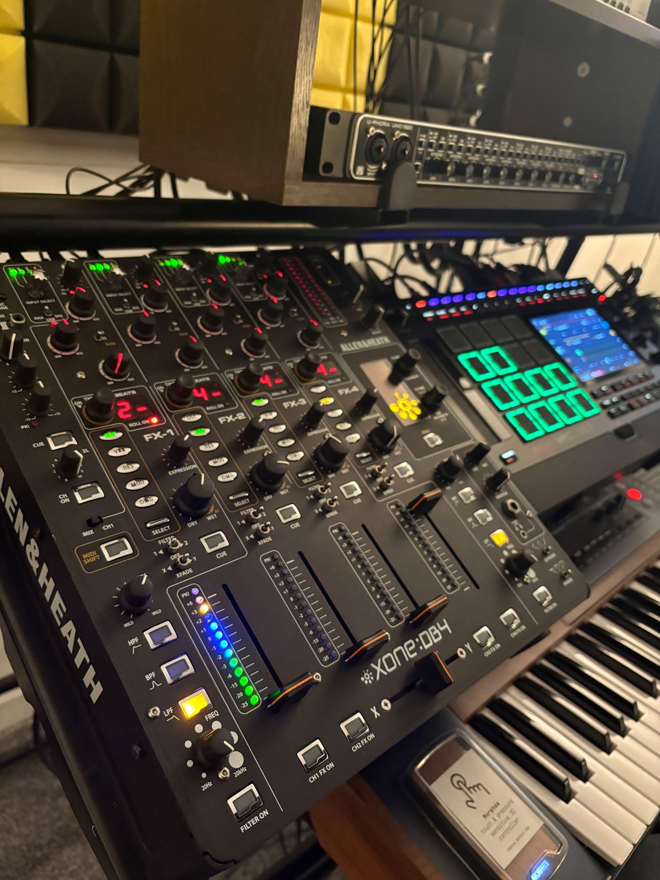 Wide-angle view of an MPC Live 3 beside an Allen and Heath Xone DB4 in a music studio.